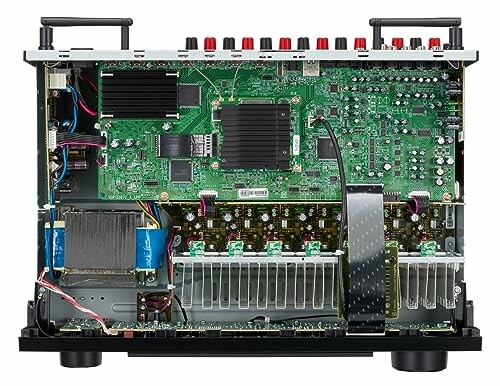 Internal view of an audio amplifier showing circuit boards and components.